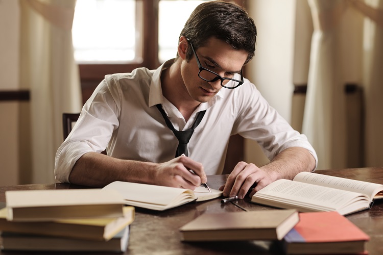 man-writing-books